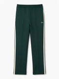 Lacoste Pantaloni PIPED TRACK PANTS verde per uomo con bande laterali e coulisse